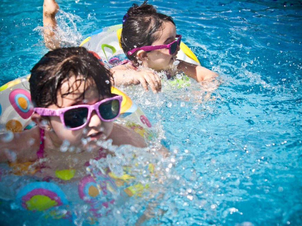 Children Swimming in Compliant Pool